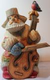 An exclusive hand carved and hand painted wooden Santa Claus playing the double bass. Did Moroz z contrabasom.
