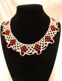 A white and red beaded choker